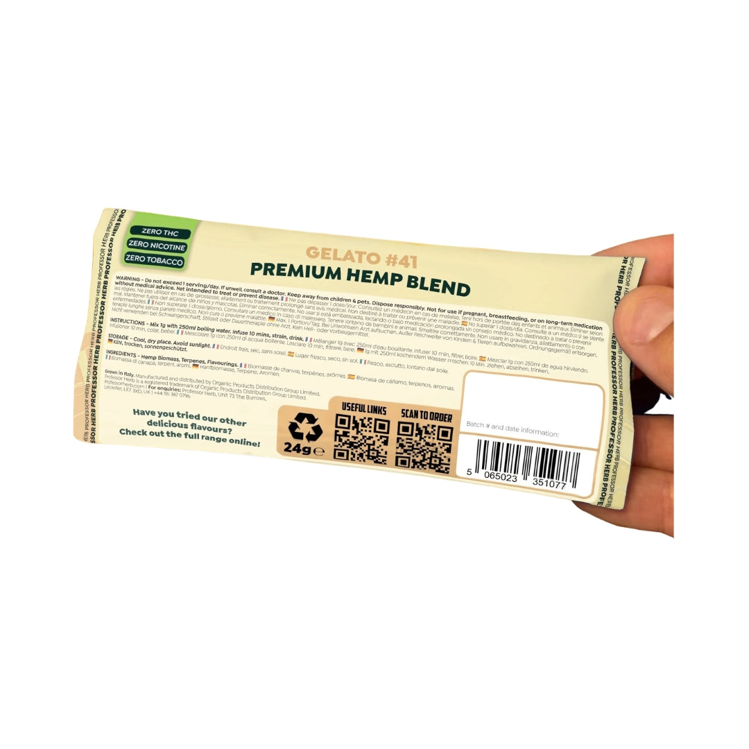 Hand holding a package labeled 'Premium Hemp Blend' with visible text and graphics.